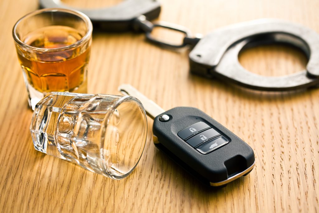 Alcohol, handcuffs, and keys