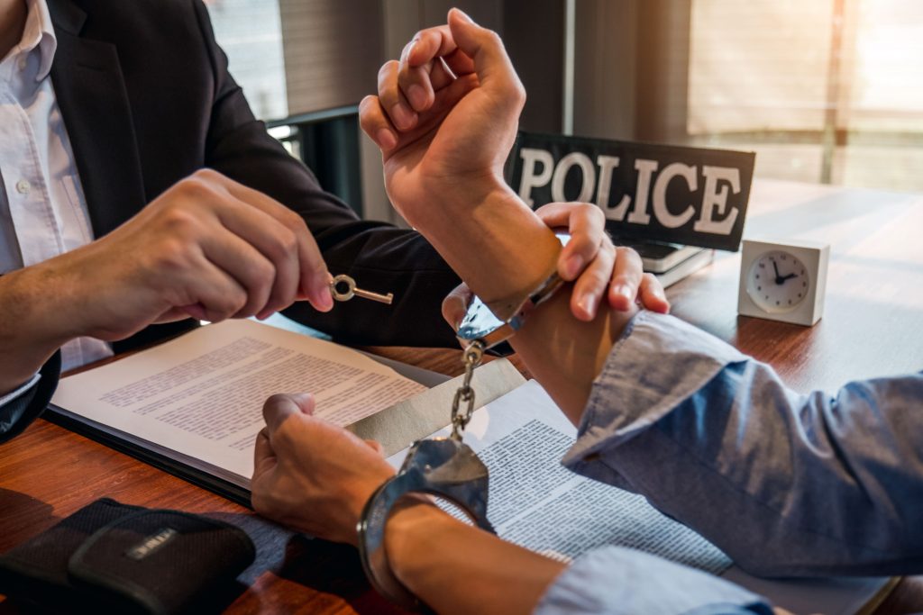 law-enforcement-officer-interrogating-criminals-ma-2023-11-27-05-36-56-utc