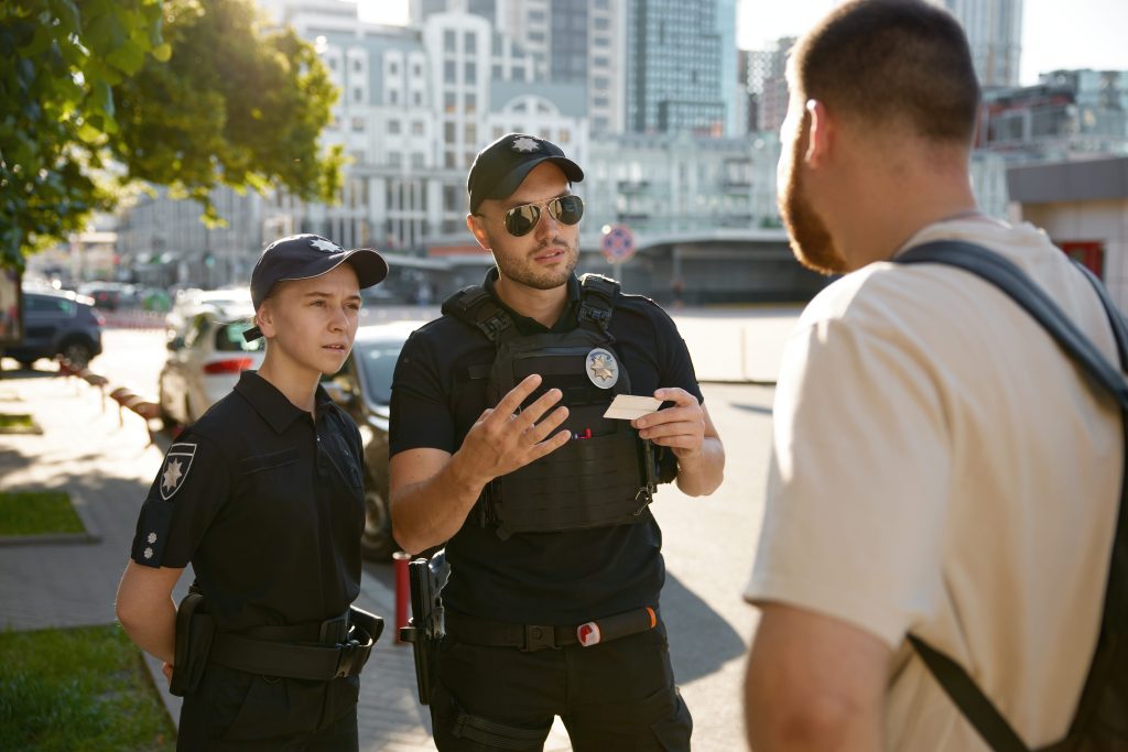 patrol-policeman-and-policewoman-checking-personal-2024-10-14-23-32-59-utc