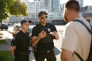 patrol-policeman-and-policewoman-checking-personal-2024-10-14-23-32-59-utc
