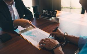 police-pointed-to-the-document-for-the-suspect-to-2023-11-27-05-07-58-utc