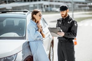 policeman-with-female-driver-on-the-roadside-2023-11-27-05-33-36-utc