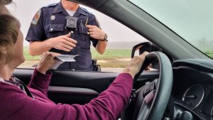 senior-woman-stopped-for-speeding-hands-her-car-re-2023-11-27-04-57-00-utc