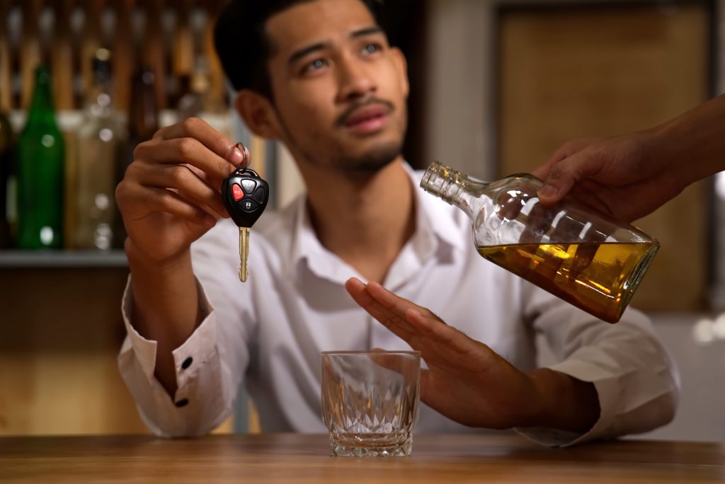the-man-holding-the-car-key-refusing-alcohol