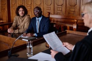 two-young-intercultural-male-attorneys-looking-at-2023-11-27-05-03-41-utc